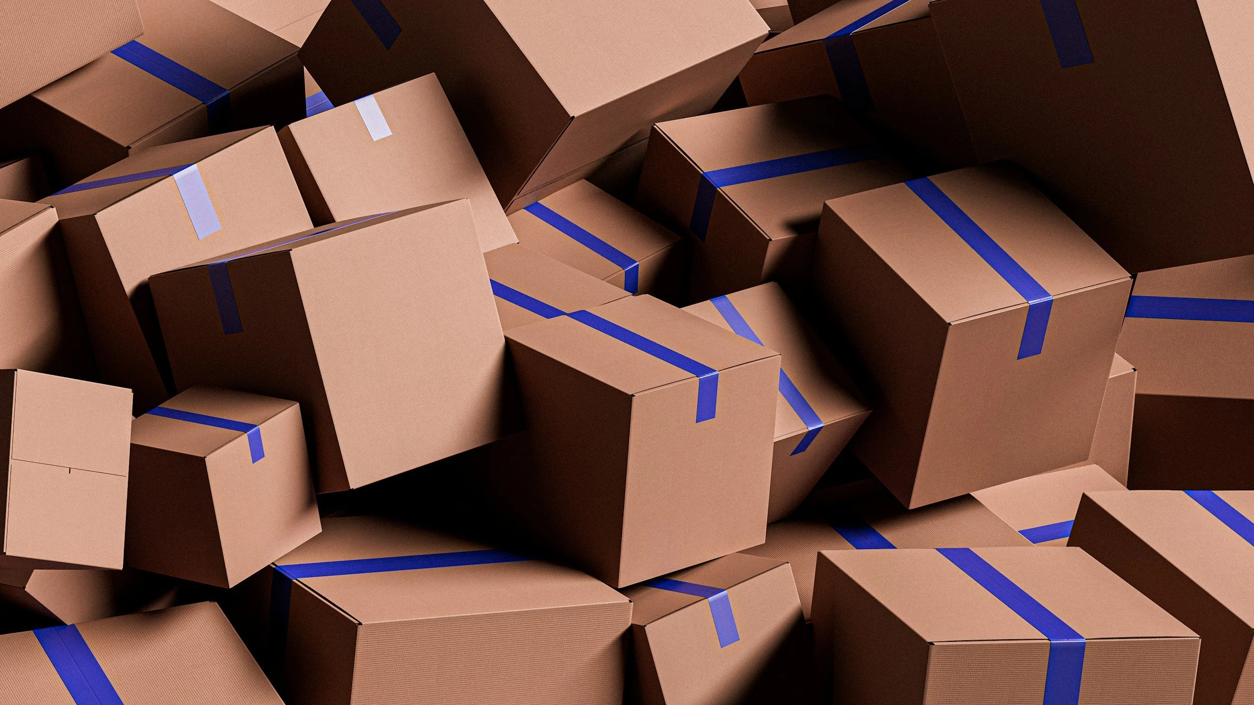 A large pile of cardboard boxes, some sealed with blue tape.