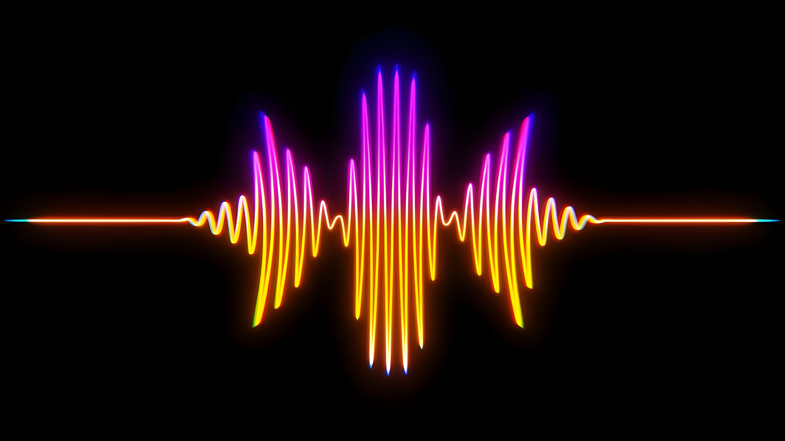 Colorful neon sound wave on a black background with pink, purple, yellow, orange, and blue hues.