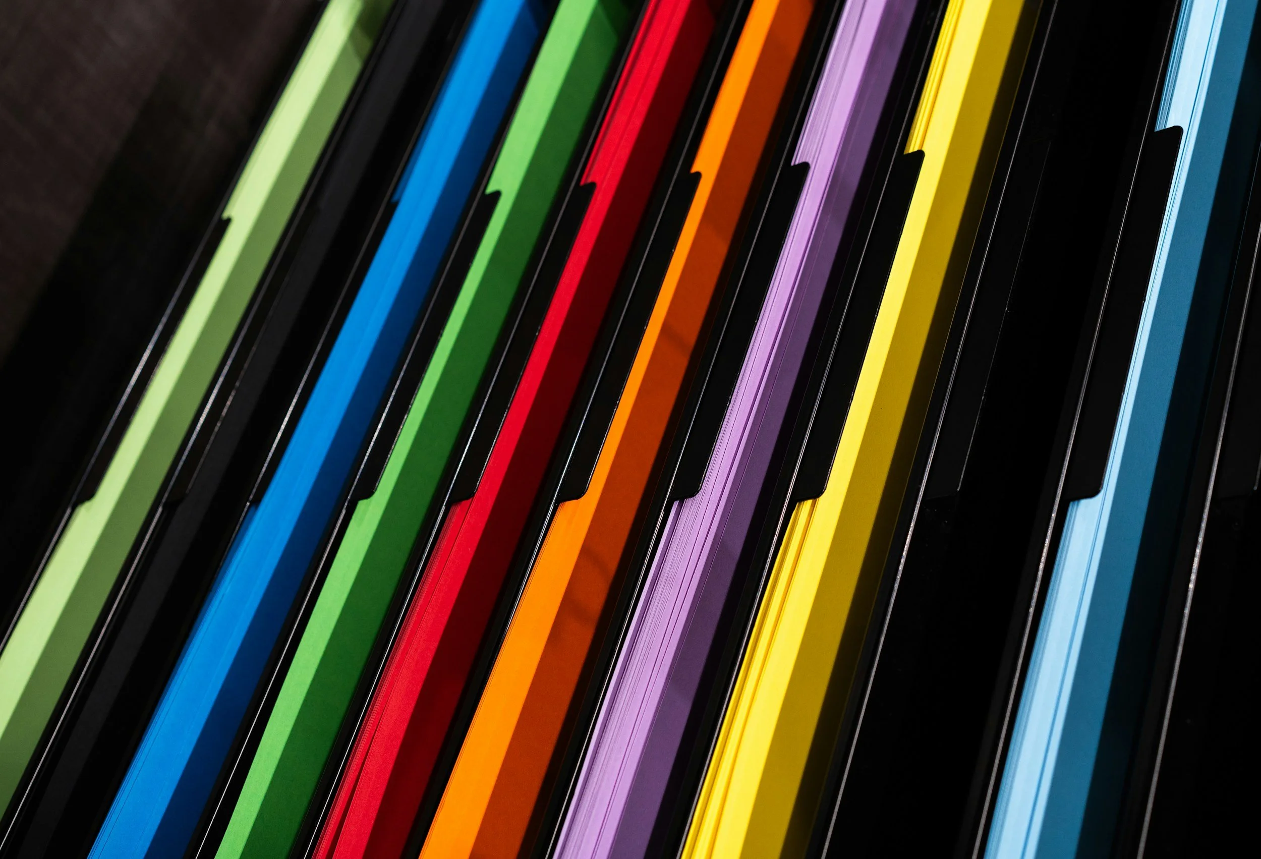 Close-up of colorful neon led strip lights arranged diagonally.